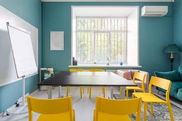 Hall with a large desk and many chairs